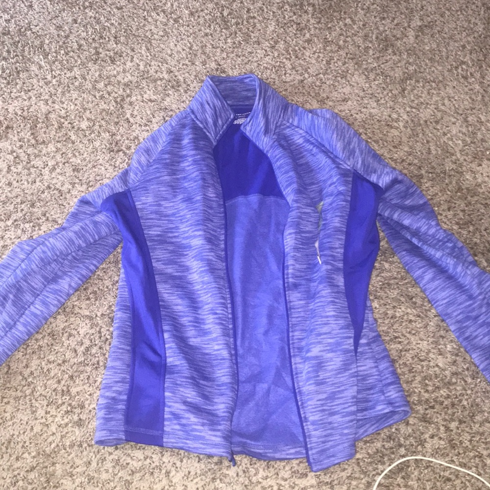 100% polyester zip up jacket.